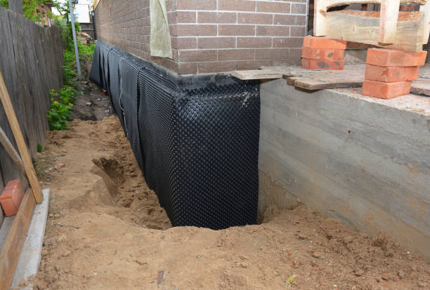 Happy homeowners after waterproofing job in Lake Hiawatha
